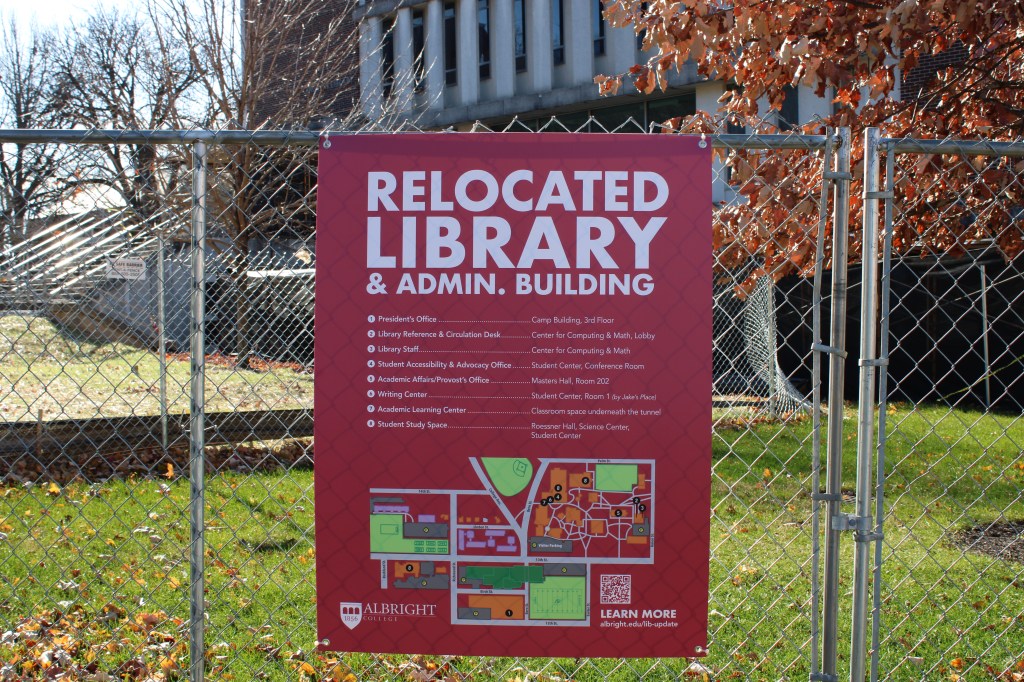 A sign with information on the relocation of the offices and resources.