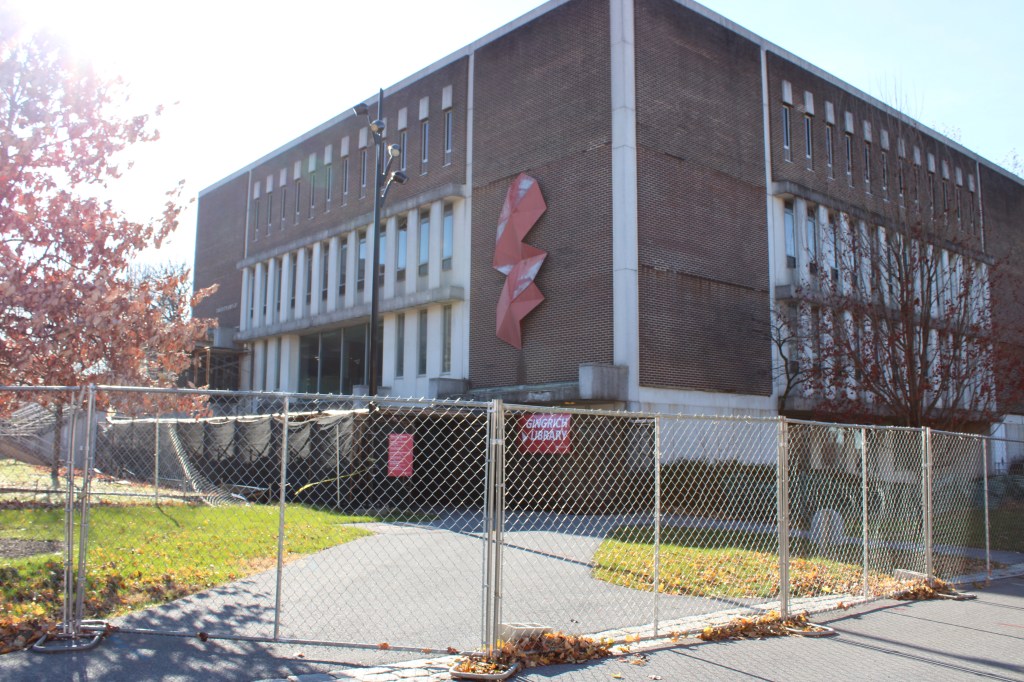 A fence surrounds Albright College's library building.