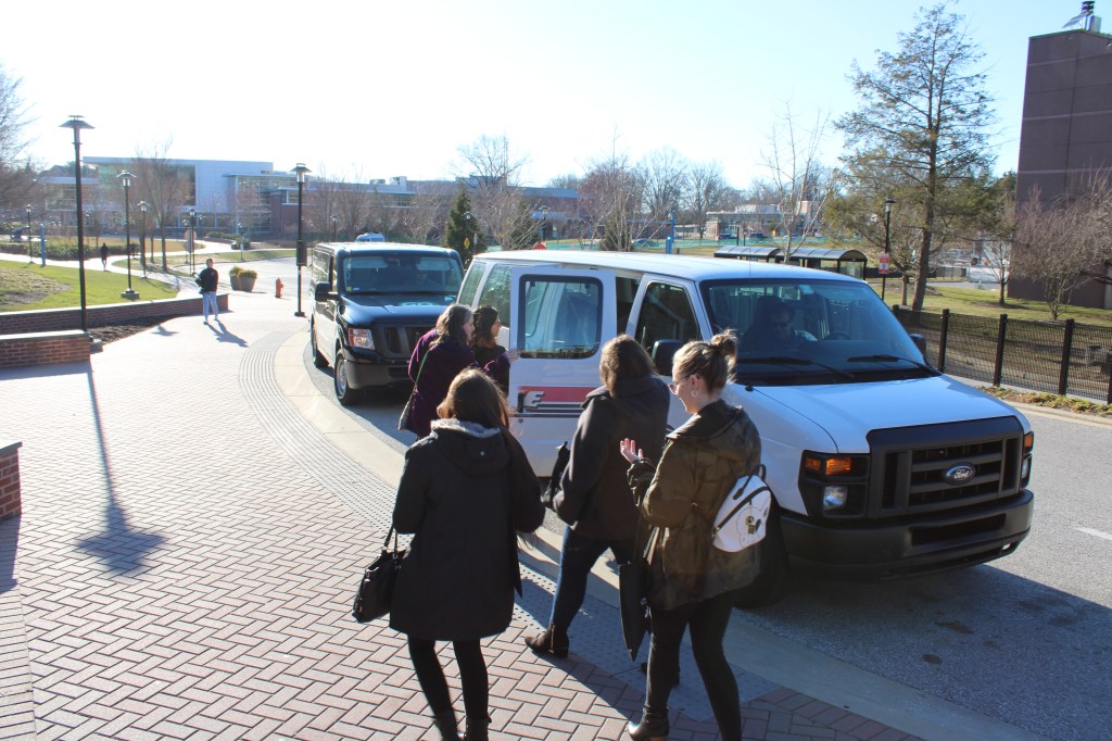 The Albright writing center team boards the van to campus.